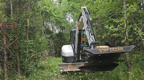 clearing trails with mini excavator|bobcat mini logging road.